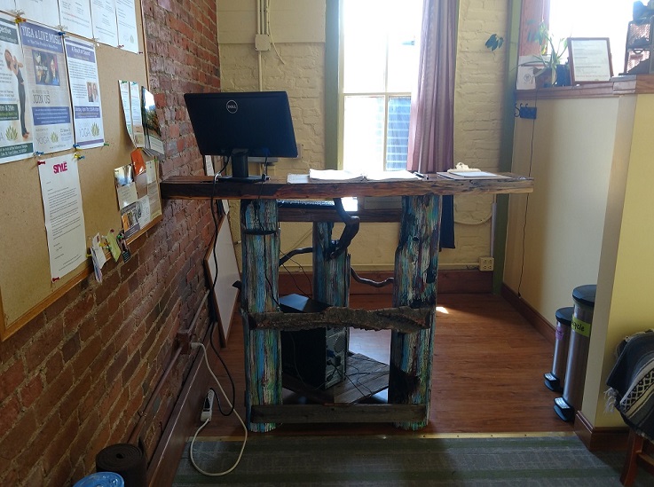 A wooden table used at a local yoga studio