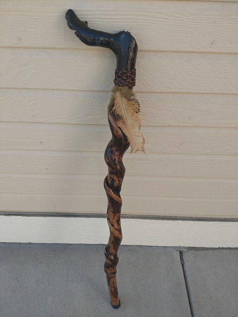 Custom driftwood cane leaning against a wall
