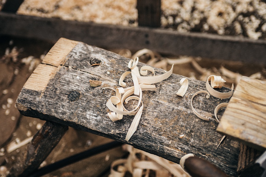 Pieces of wood and shavings on a woodworking table